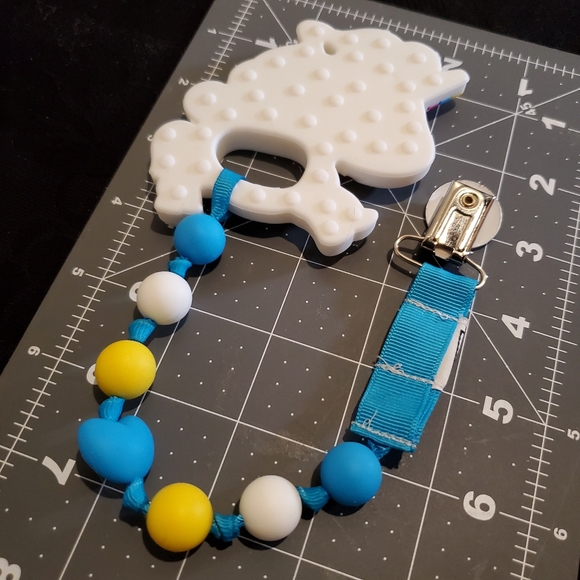 Baby Root Clip-On Unicorn Teether, white blue and yellow, not chewed - Picture 3 of 4